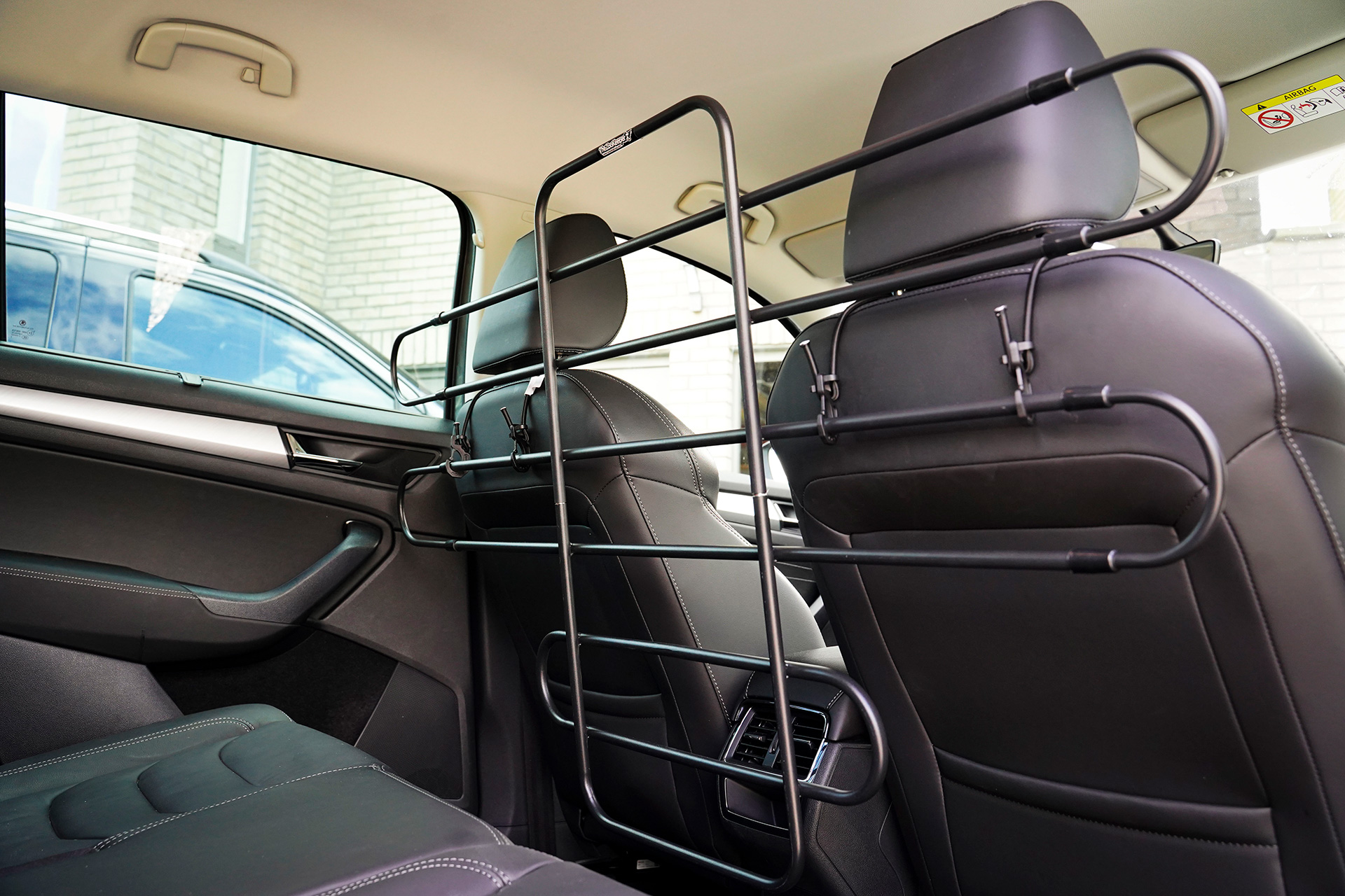Metal barrier between car seats